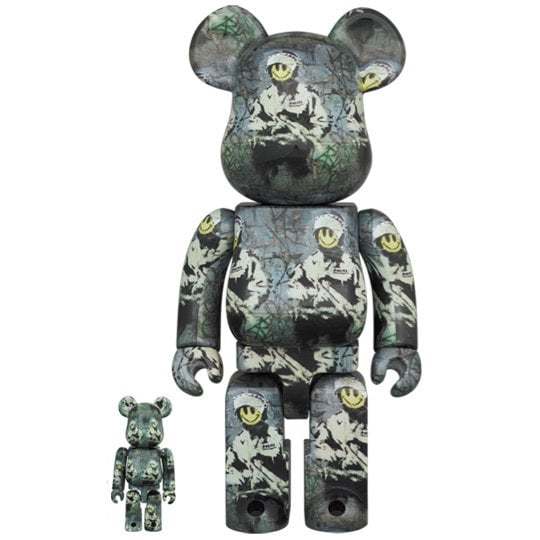 Bearbrick sæt featuring Riot Cop artwork by Brandalism x Banksy with unique all-body print and smiley face design